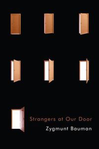 Cover image for Strangers at Our Door