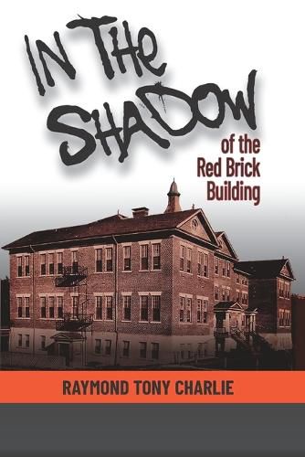 Cover image for In The Shadow Of The Red Brick Building