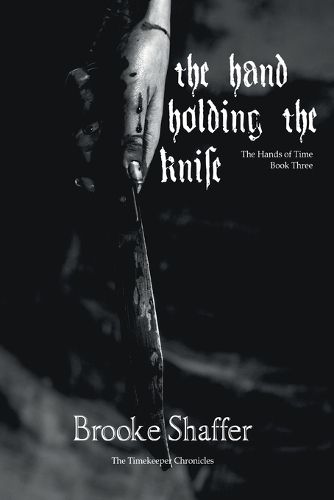 Cover image for The Hand Holding the Knife