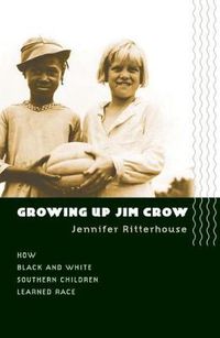 Cover image for Growing Up Jim Crow: How Black and White Southern Children Learned Race