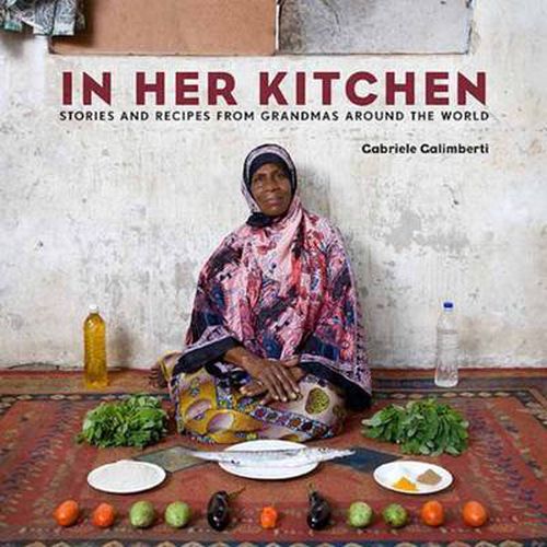 Cover image for In Her Kitchen: Stories and Recipes from Grandmas Around the World: A Cookbook