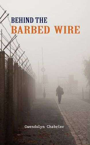 Cover image for Behind the Barbed Wire