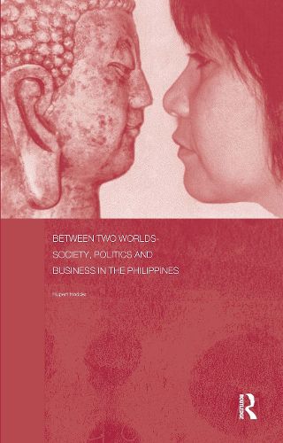 Cover image for Between Two Worlds - Society, Politics, and Business in the Philippines