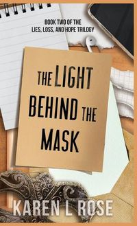 Cover image for The Light Behind the Mask