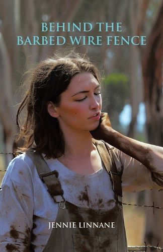 Cover image for Behind the Barbed Wire Fence