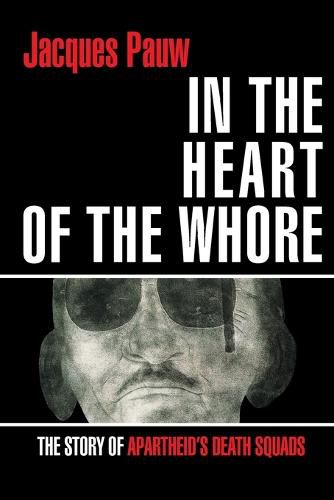 Cover image for In the heart of the whore: The story of apartheid's death squads