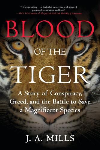 Cover image for Blood of the Tiger: A Story of Conspiracy, Greed, and the Battle to Save a Magnificent Species