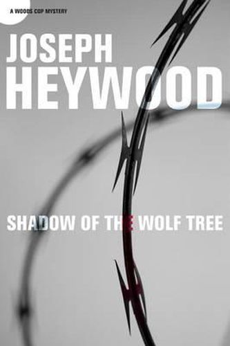 Cover image for Shadow of the Wolf Tree: A Woods Cop Mystery