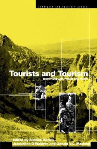 Cover image for Tourists and Tourism: Identifying with People and Places