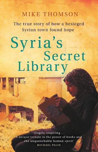 Cover image for Syria's Secret Library: The true story of how a besieged Syrian town found hope