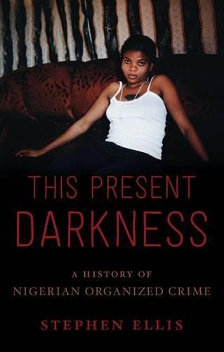 Cover image for This Present Darkness: A History of Nigerian Organized Crime