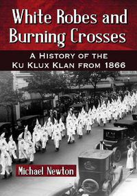 Cover image for White Robes and Burning Crosses: A History of the Ku Klux Klan from 1866