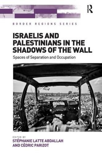 Cover image for Israelis and Palestinians in the Shadows of the Wall: Spaces of Separation and Occupation