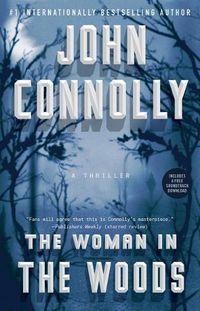 Cover image for The Woman in the Woods: A Thriller