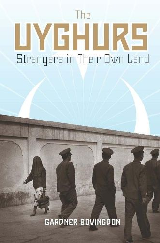 Cover image for The Uyghurs: Strangers in Their Own Land