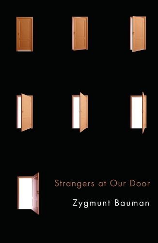 Cover image for Strangers at Our Door