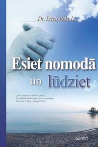 Cover image for Esiet NomodĀ Un LŪdziet