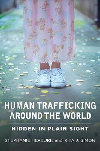 Cover image for Human Trafficking Around the World: Hidden in Plain Sight